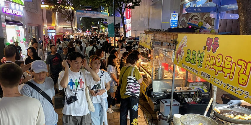 Shop at Myeongdong, a vibrant street offering fashion, cosmetics, and delicious street food—perfect for things to do in South Korea