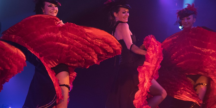 Vibrant cabaret show with dazzling performances and elaborate costumes.