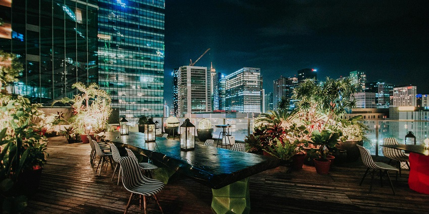 Nightlife in Qatar rooftop bar with panoramic views of the Doha skyline