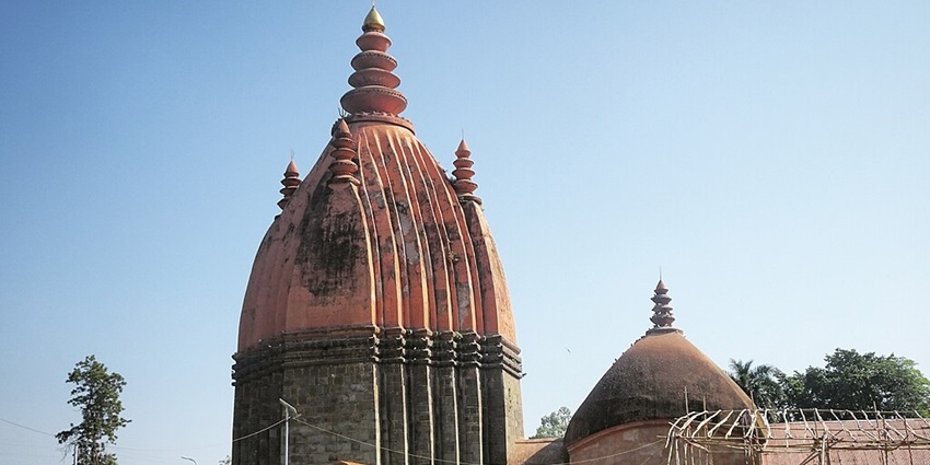 A garden and exteriors of Siva Dol, one of the revered temples in Sivasagar