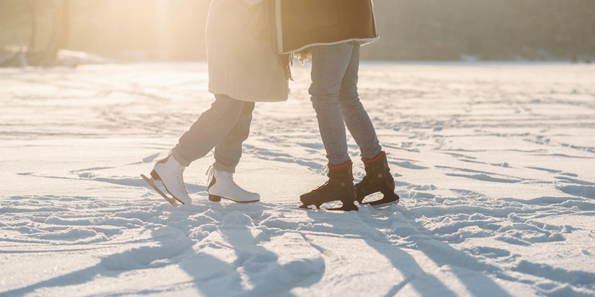 Image of People Standing Wearing Ice Skating Shoes - one of the best things to do