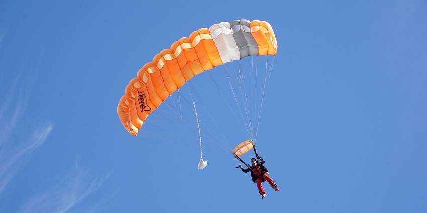 An image showing two people tandem skydiving, highlighting the exhilaration of the experience