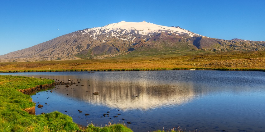 A picture of glacier-capped Snæfellsjökull Volcano, one of the best places to visit in Iceland.