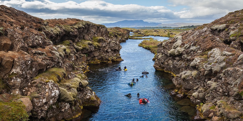 Snorkelling and diving in Silfra Fissure in Thingvellir National Park.
