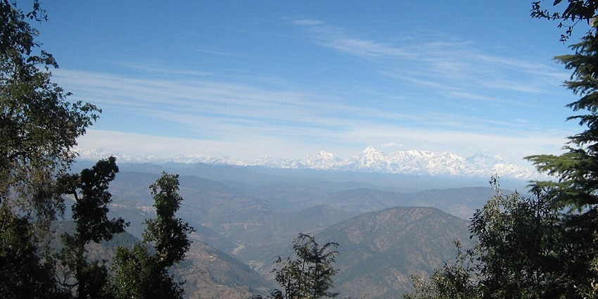 A distant view of the Himalayas from the Snow View Point in Nainital, Uttarakhand.