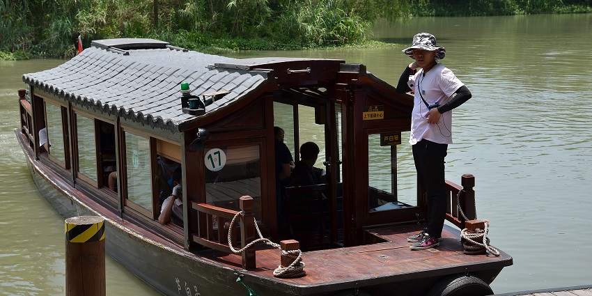 Image of a boat ride at the Xixi National Wetland Park - things to do in Hangzhou China