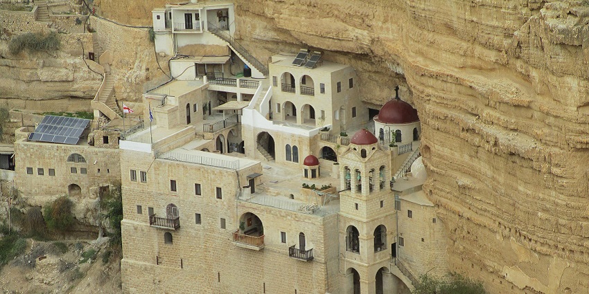 Historic Greek Orthodox monastery perched on the cliffs of Wadi Qelt.