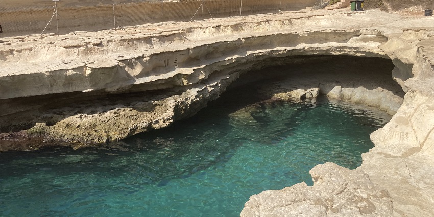 Numerous tourists flock to the St. Peter’s Pool near Marsaxlokk in Malta, a stunning beach