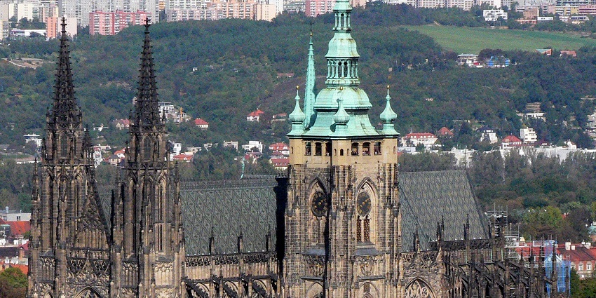 An image of St. Vitus Cathedral's stunning stained glass window, places to visit in Prague.