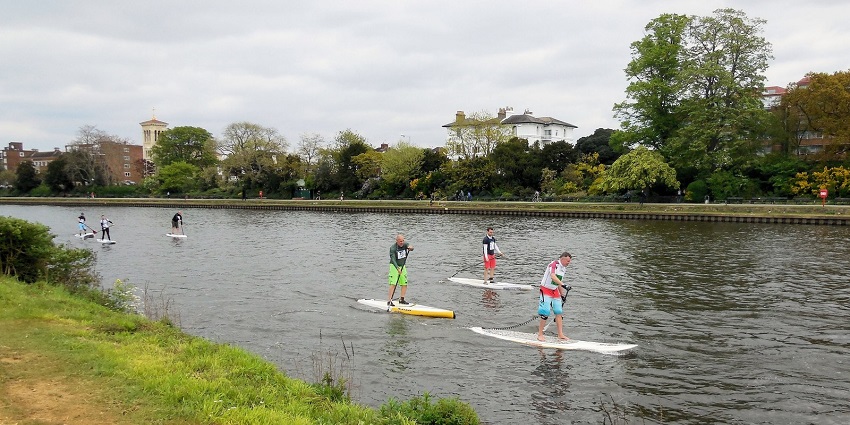 Glide on water with stand-up paddleboarding fun with Vagator Beach water sports.