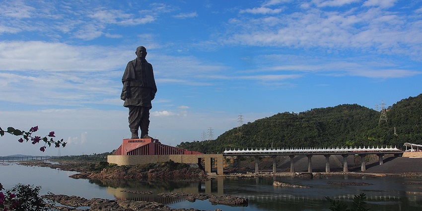 The Statue of Unity stands tall, as seen across the Narmada River in Kevadia, Gujarat