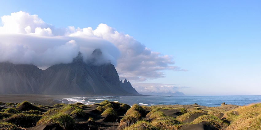 An image of Stokksnes Beach in Iceland, with stunning views of black sand and mountains.