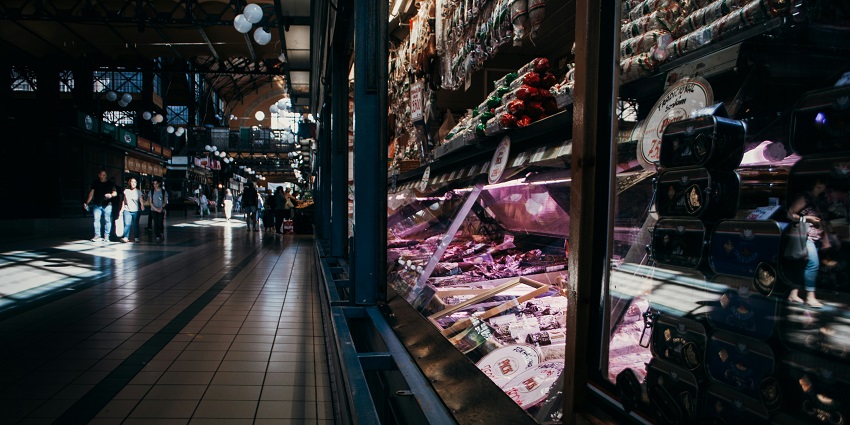 A picture of the view of the Great Market Hall in Budapest, featuring vibrant stalls.