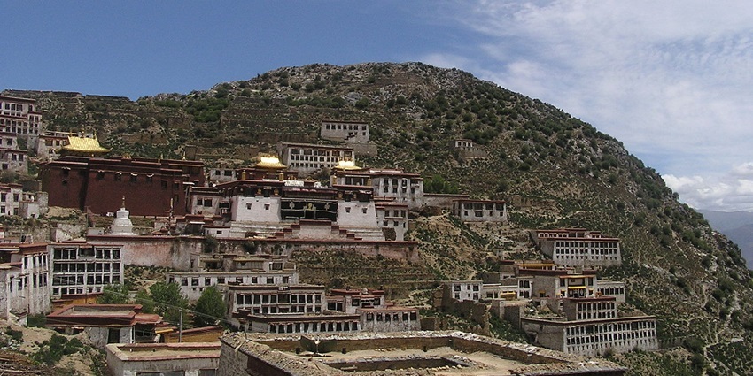 Buddhist monks in the Ganden monastery for guided tours.