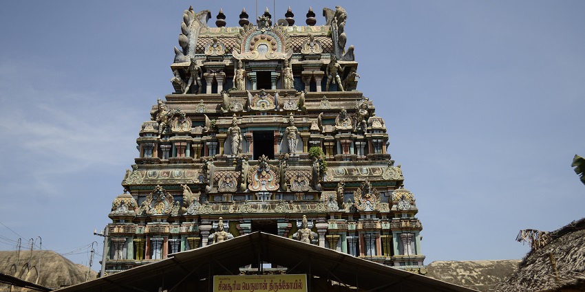 Suryanar Kovil entrance with gopuram, traditional architecture, intricate carvings.