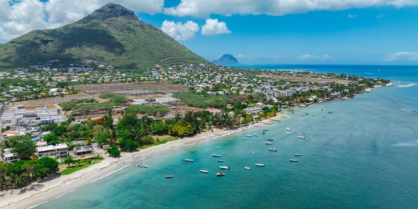 A breathtaking view of the Tamarin Bay with azure waters and lush green meadows.