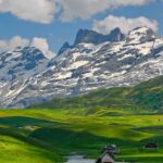 Switzerland travel guide takes you through Lucerne Lake's serene magnificence with snow-capped peaks