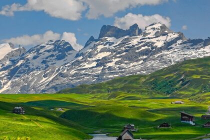 Switzerland travel guide takes you through Lucerne Lake's serene magnificence with snow-capped peaks