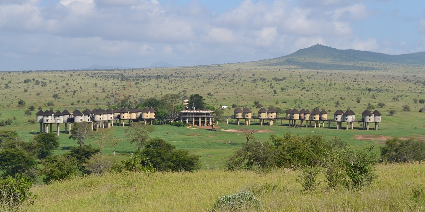 Salt lick game lodge from a distance surrounded by Taita Hills Wildlife Sanctuary landscape