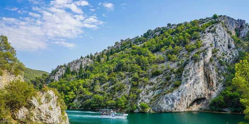 A view of a boat tour on the Krka River, highlighting the Croatian park activities.