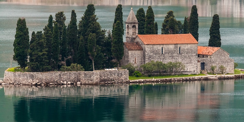 A picture of a Montenegro which offers stunning beaches and nice mountain ranges.