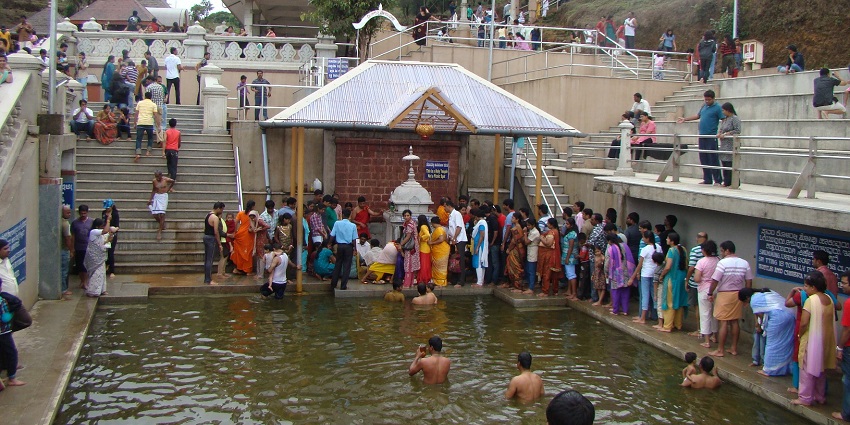 Devotees queue near a holy pool to worship in Talacauvery in the Kodagu District(Coorg), Karnataka.