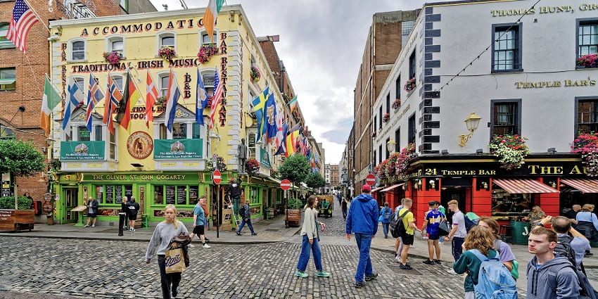 A picture of Temple Bar Square, bustling with vibrant pubs, and cobblestone streets.