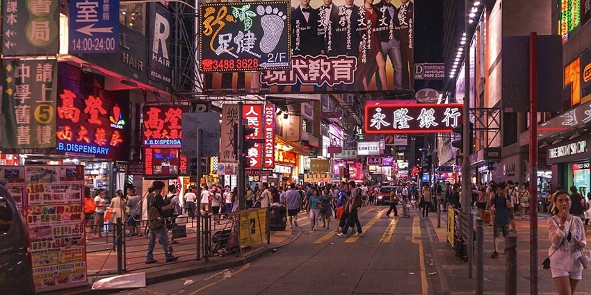 Bustling market with food, clothing, and local street vendors.