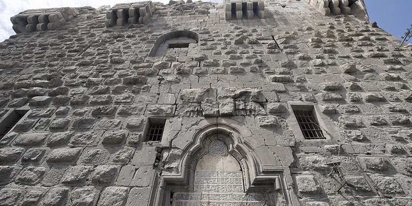 It is the picture of the eastern gate of The Citadel of Damascus located in Syria