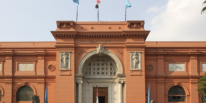 A front view of the Egyptian Museum, whose outer structure is covered in brick-colour