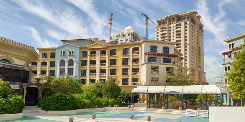 Luxury artificial island featuring shopping, dining, and waterfront views, featured in Doha city guide.
