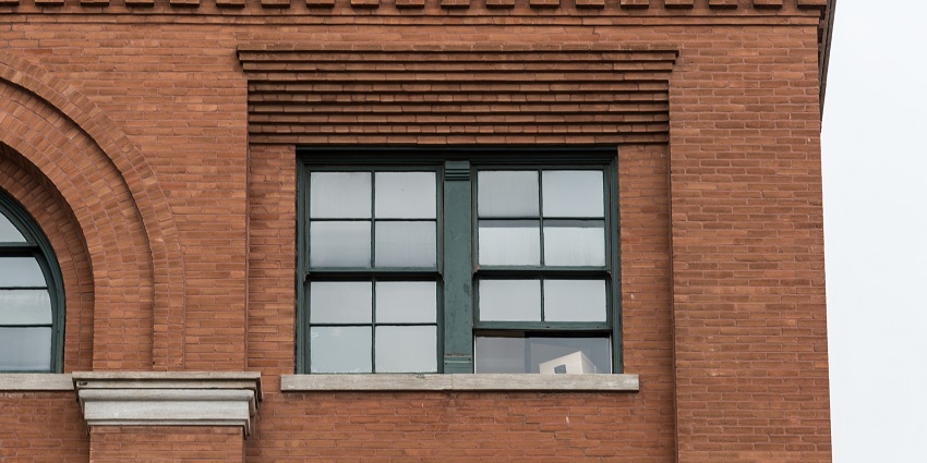 An image of visitors watching the Kennedy Assassination video at The Sixth Floor Museum