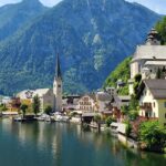 A picture ofHallstatt, Austria, with colourful buildings along the Inn River and Alps