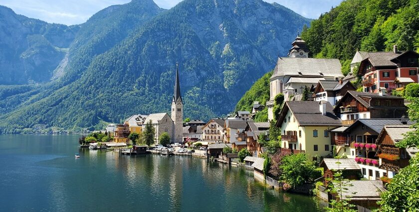 A picture ofHallstatt, Austria, with colourful buildings along the Inn River and Alps