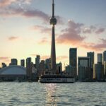 Toronto in the morning with the Tall CN tower, tall skyscrapers and Lake Ontario