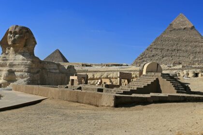 The pyramids of Giza featuring the Sphinx is looking mesmerising under a blue sky