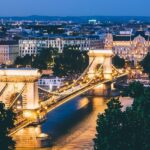 A view of Budapest's Chain Bridge, with the light reflecting through the Danube River.