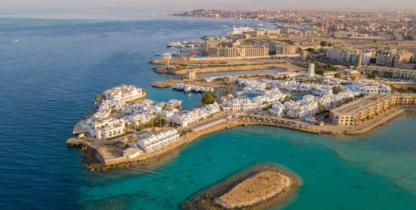 An aerial view of Hurghada adjacent to the Red Sea, featuring white buildings all over.