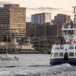 A ship sails through the water near Halifax’s skylines, Nova Scotia, Southern Canada.