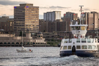 A ship sails through the water near Halifax’s skylines, Nova Scotia, Southern Canada.