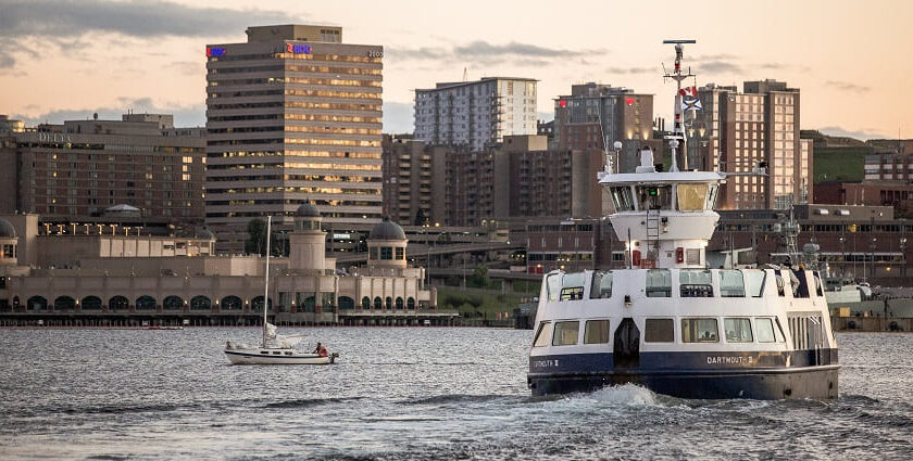 A ship sails through the water near Halifax’s skylines, Nova Scotia, Southern Canada.