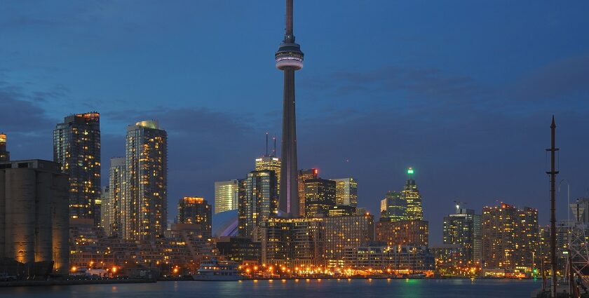 A view of Toronto Skyline at dusk featuring CN Tower and other tall skyscrapers