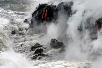 A spectacular moment when hot lava meets the ocean, forming new rocks in Hawaii.