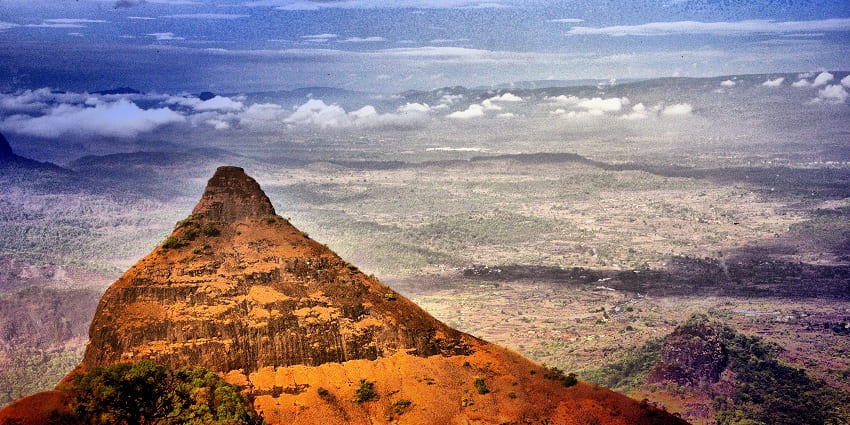 Scenic cliff offering breathtaking views of Lonavala's valley, featured in Lonavala travel guide.