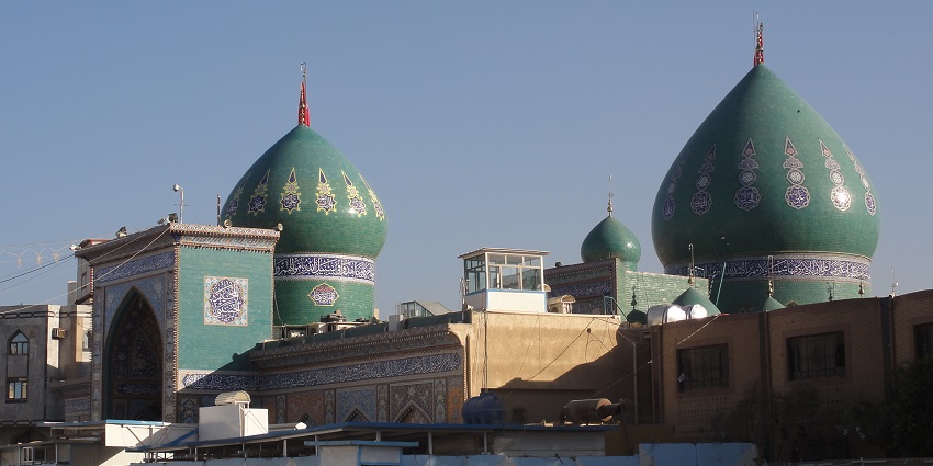 The view of a minaret in Karbala Mosque, viewed from the gate.