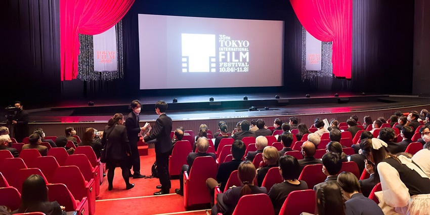 Audience seated in a grand hall during the Tokyo International Film Festival opening ceremony.