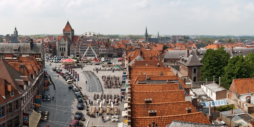 Tournai’s medieval skyline featuring Notre-Dame Cathedral and historic stone bridges.