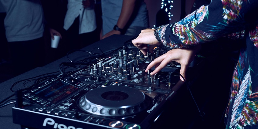 A lively crowd dancing and socialising, capturing the energy and excitement of a party atmosphere.