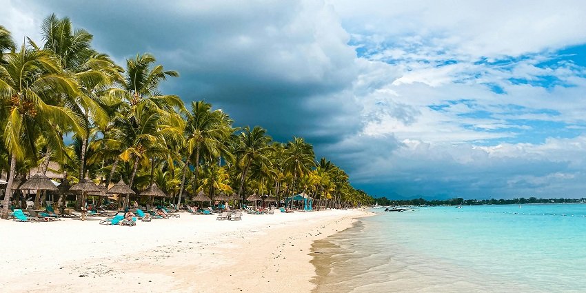 The deep turquoise-coloured water body is shown alongside the Trou aux Biches beach.