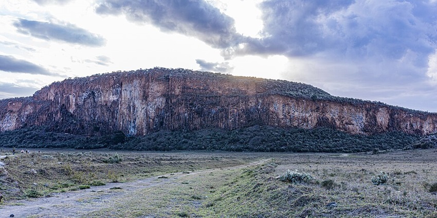 View of the Hells Gate National Park while biking amidst greenery and distant mountains.